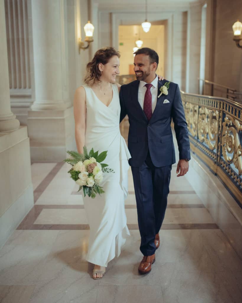 a couple walking at city hall hallway