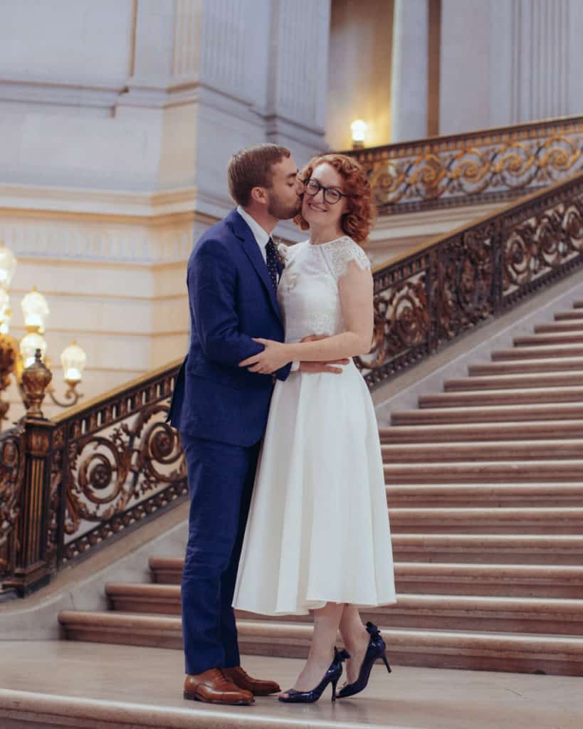 a couple kissing on the grand staircase