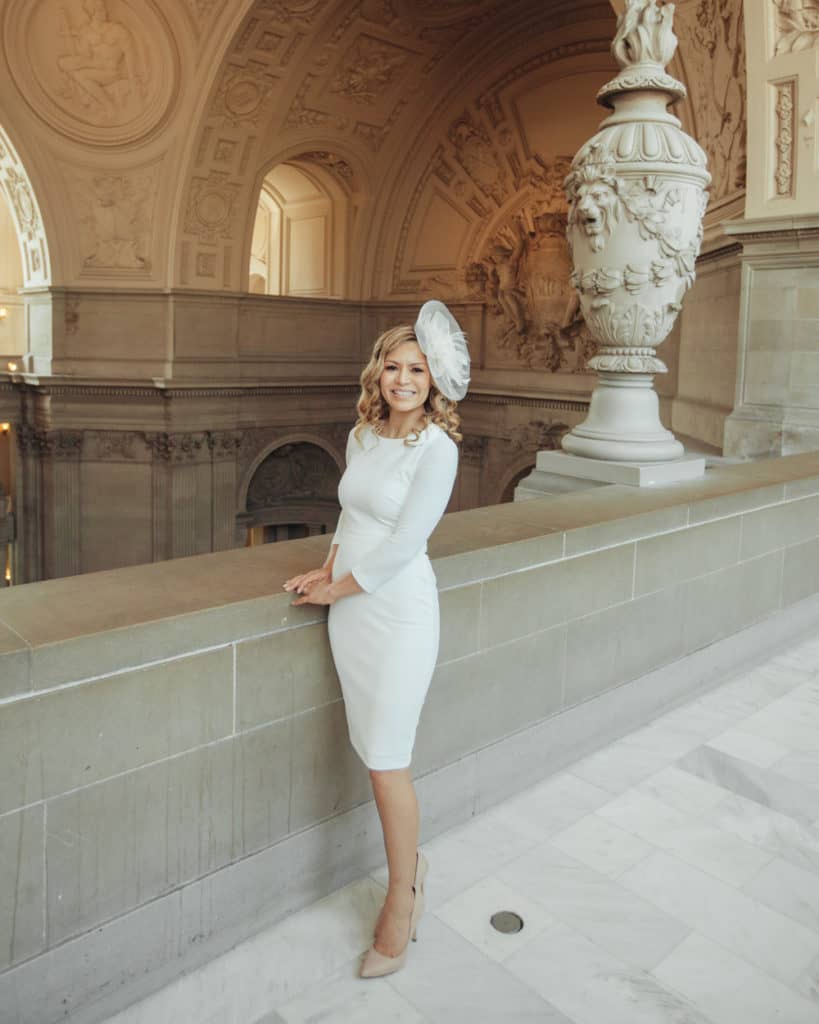a bride with a unique hairpiece posing on the 4th floor