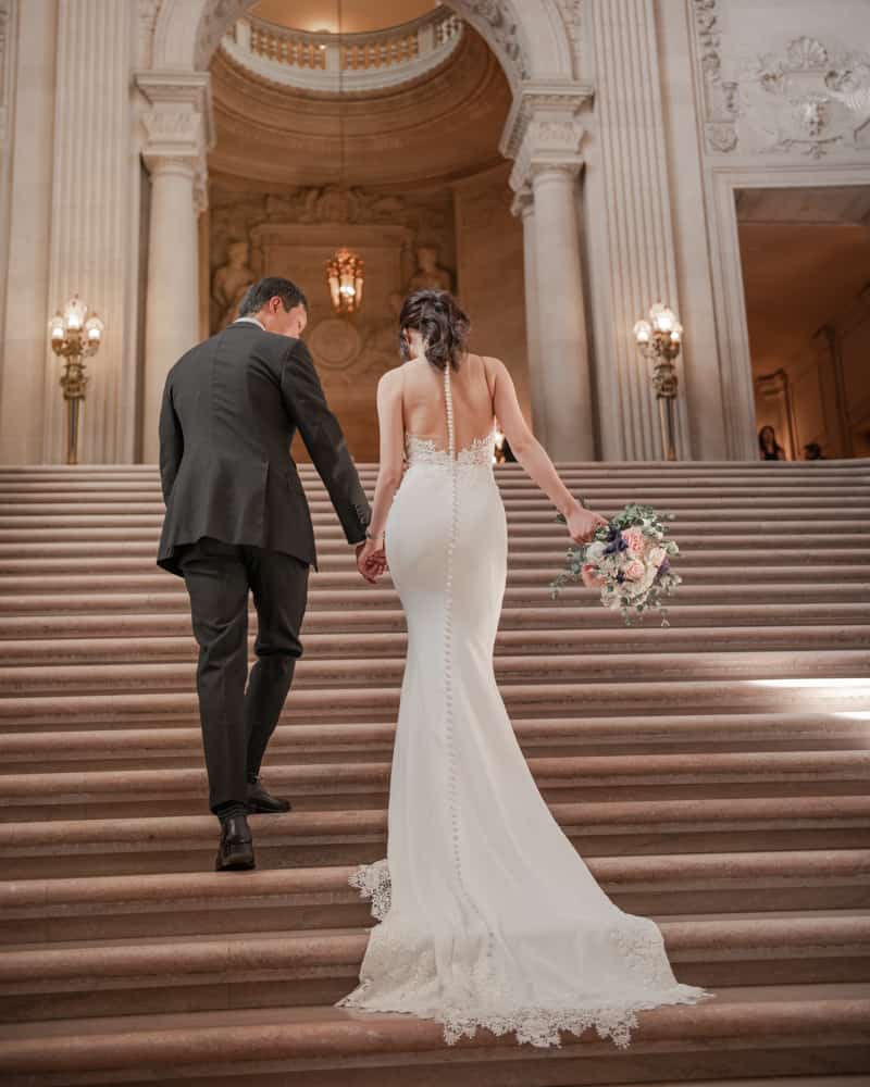 a couple walking up the grand staircase